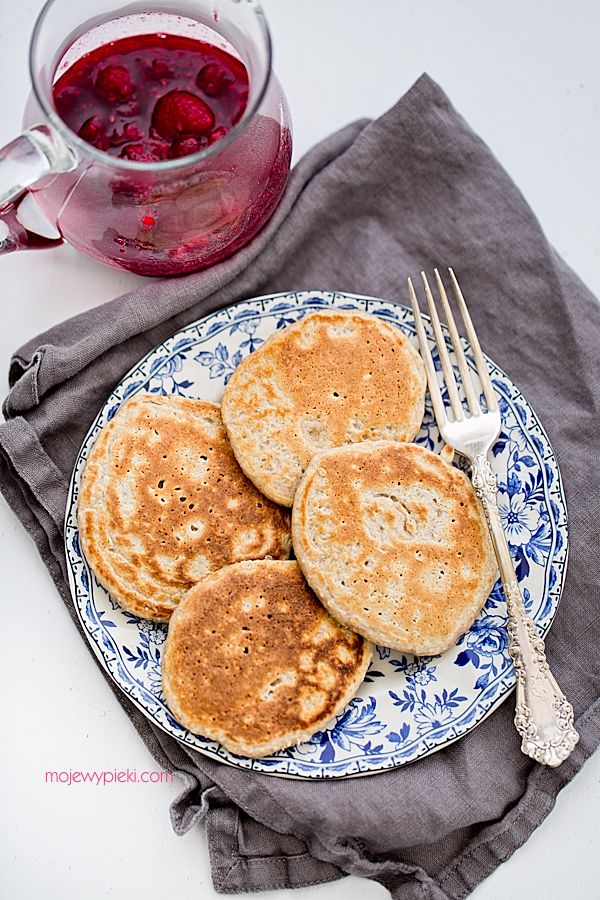 Oat pancakes with raspberries in honey syrup