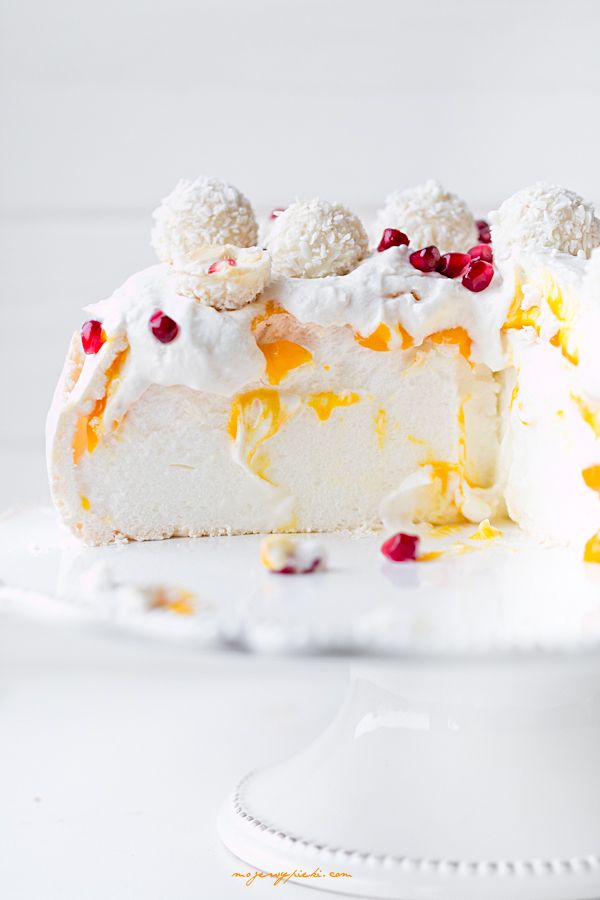 Coconut Pavlova with mango sauce and pomegranate