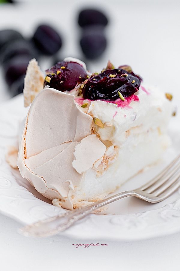 Pavlova with roasted plums and pistachios