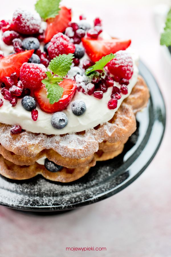 Waffle layer cake with cream and fresh berries