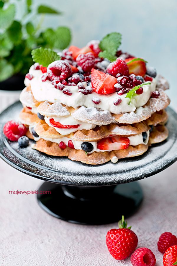 Waffle layer cake with cream and fresh berries
