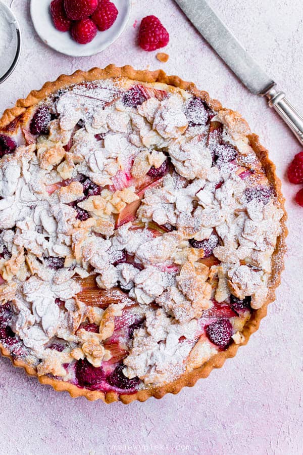 Rhubarb, raspberry and almond praline tart