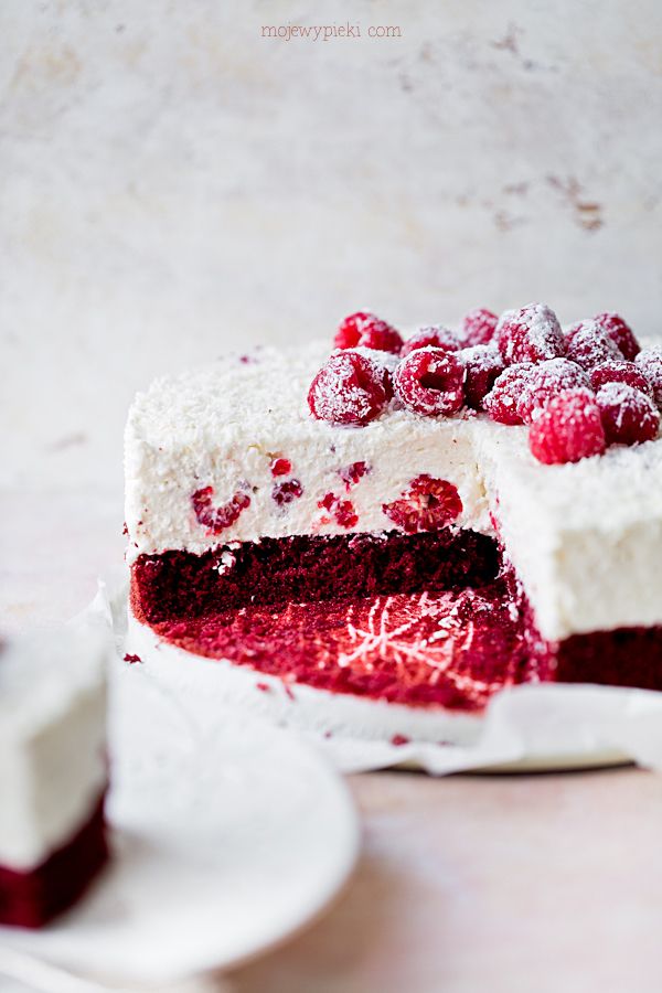 Raspberry and coconut dessert on red velvet cake