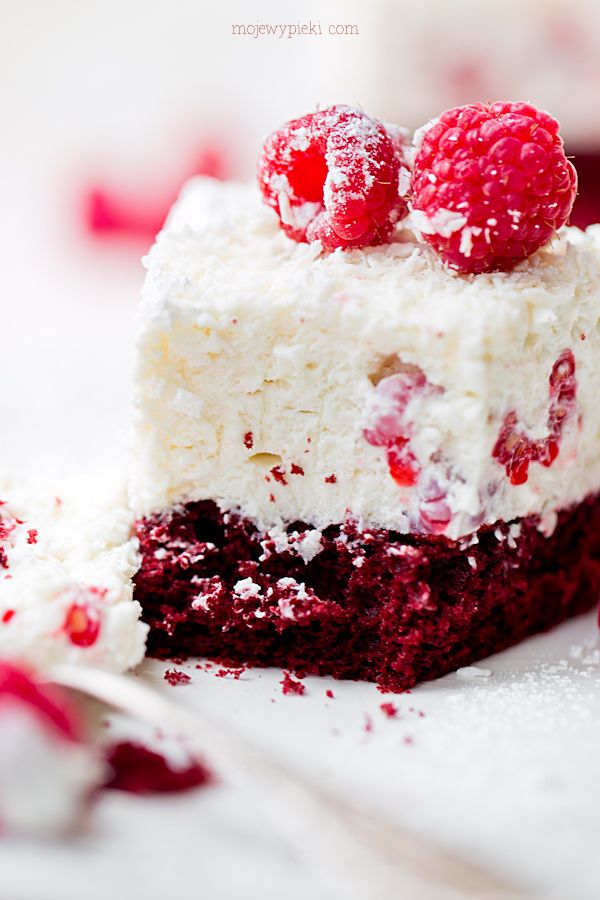 Raspberry and coconut dessert on red velvet cake
